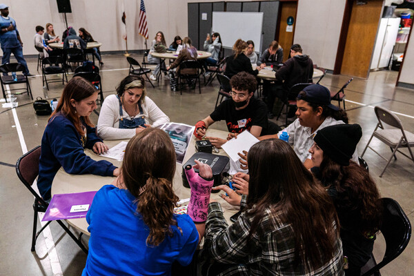 students sitting around table